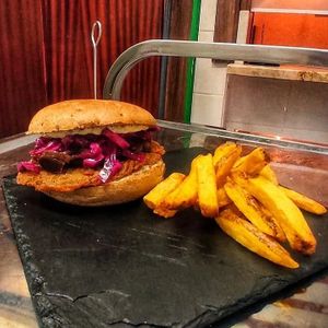 Pleurotus burger with caramelized leeks, marinated purple cabbage and thyme mayonnaise at Mordi e Faggi - Vegan Pub & Winery in Rome