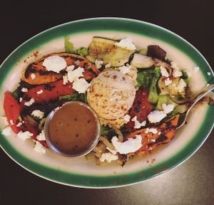 The hummus salad served with grilled seasonal vegetables, a dollop of hummus and sprinkled with feta at Brews N Bytes Internet Cafe and Eatery in Danville