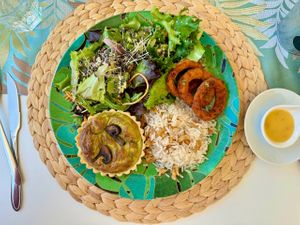 Menu of the day: Quiche, salad, onion rings, rice. at Alma Veg  in Carcavelos