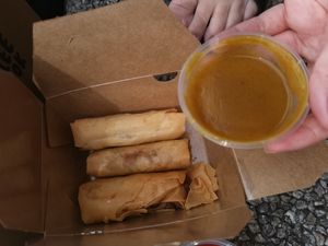Spring roles with curry sauce at Ho Lee Fook  in Glasgow