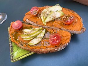 Tostadas de Hummus con tomate   at Dancing Coffee Shop in Granada