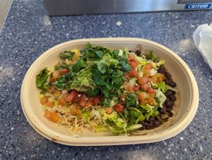 Burrito bowl (rice, beans, guac, lettuce, tomato, cilantro) at LAS - Moe's Southwestern Grill - T1 in Las Vegas
