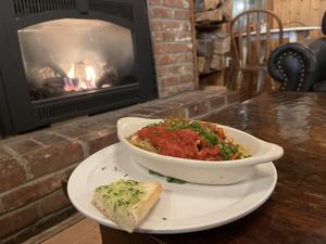 Vegan lasagna with garlic bread   at June Bug Cafe in Midpines