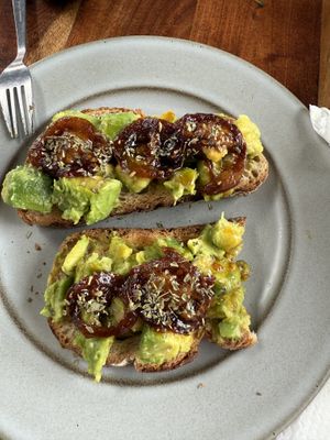 Avocado toast with caramelized  tomatoes   at Papaya Cafe in Santa Maria