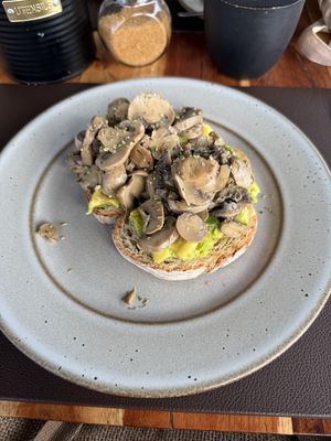 Avocado toast with mushrooms   at Papaya Cafe in Santa Maria
