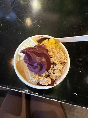 Acai bowl with mango, peanut butter, granola and banana  at Papaya Cafe in Santa Maria