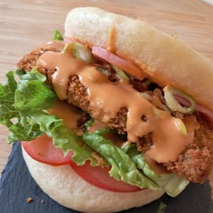 Buffalo Bao - breaded soy steak with pickled onions at Baomerang in Porto