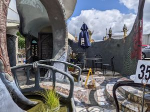 I sat in the sun near the entrance gate and little moat at Eutopia Cafe in Kaiwaka