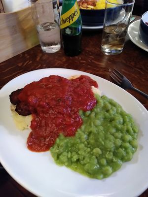 Vegan sausage, mushed peas, roasted tomato sauce and mustard mashed potato at The Old Nags Head in Edale
