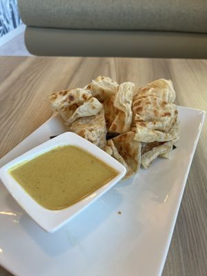 Roti canai- spicy coconut sauce (really good!)  at Padmanadi Vegan Eatery in Calgary