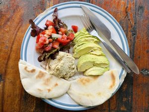 Hummus w/ avocado, tomato & pita (95 THB)  at Om Garden Cafe in Pai