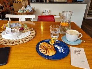 Schoko-Franzbrötchen, Cappuccino mit Hafermilch at PA.LE Café & Pop-Up Store in Bad Koenigshofen