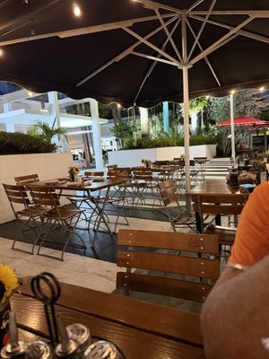 Outdoor seating is just in front of the restaurant with a pedestrian walkway in between  at Spris Artisan Pizza in Miami Beach