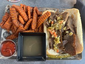 Vegan Italian beef handheld with sweet potato fries  at Alter Brewing + Kitchen in Oak Brook