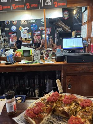 In the mirror chowing down  at Caliente Pizza & Drafthouse - Liberty Ave in Pittsburgh