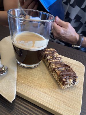 Coffee with oat bar at Lucette in Lausanne