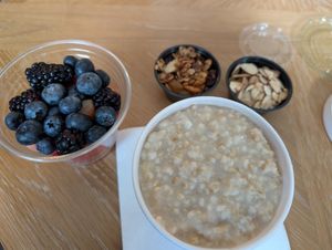 Oatmeal with toppings, fresh fruit for takeout at TRACE Market in Seattle