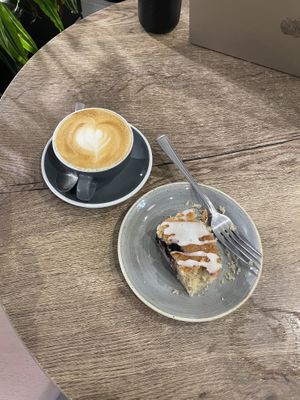 Oat Milk Flat White and Blueberry lemon Loaf   at Scandinavian Kitchen in London