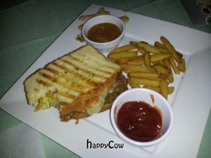 Stomping Horse Seitan-Gluten free bread,Kute Blackson unchicken seitan,mayo,cheeze,lettuce,tomatoes,pickles, mustard and choice of sauce at Rawsheed's Raw Vegan Fusion in Granada Hills