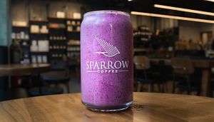 Purple Rain: Refreshing purple smoothie with blueberries, banana, tahini, and sugar, blended with oat milk.  at Sparrow Coffee in Naperville