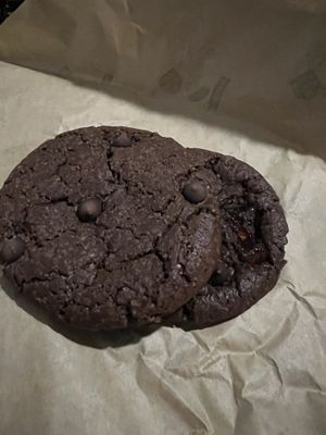 Top cookie = double chocolate, bottom cookie = double chocolate with cherries. Both very sweet and large granulated sugar used.   at Le Poulpi Place in Grasse