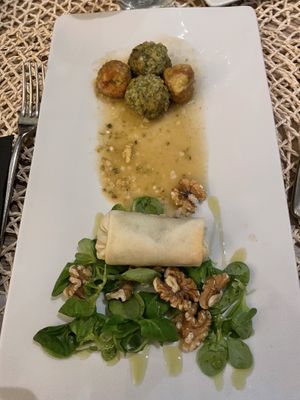 Lentil balls and a white wrap filled with pasta and nuts at Pan GhEA in Milan