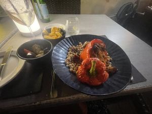 Stuffed peppers with side of chips and roasted vegetables   at The View Bar & Kitchen in Zebbug