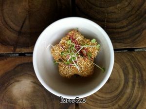 Divine brown rice star cake (onigiri) with roasted sesame seeds and fresh sprouts.
 at UVA in Bogota
