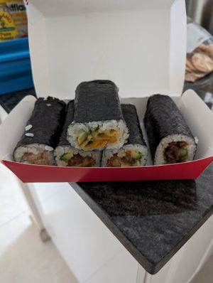 Sushi hub has a range of different plant-based sushi rolls , some with mock meat others with tempura vegetables , pumpkin or tofu at Sushi Hub Shellharbour in Shellharbour