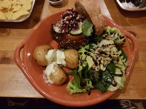 Black bean burger with potatoes, homemade mayonaise and balsamico dressing at Princesa do Castelo in Lisbon