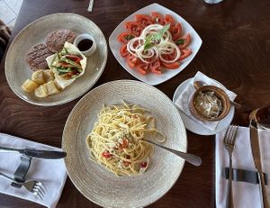 Spaghetti aglio e olio with vegan cheese, vegan bifteki and tomato salad ☺️  at Konstantin Restaurant Cafe in Rhodes