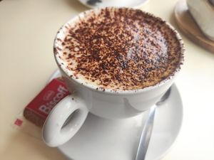 Cappuccino with oat milk a d a biscoff at A'bout Thyme in Glossop