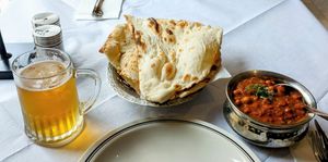 Chana masala, plain nan and Tiger beer! at Aditya Indian Restaurant in St Pauls Bay