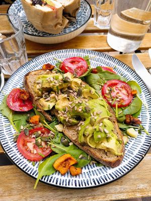 Avocado toast that just had salmon taken off the top at Mälis in Biarritz