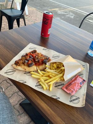 Pinsa with tomatoes and eggplant, served with fries and a drink of choice ("aperipinsa")  at PinsinoGiusto - San Teodoro in San Teodoro