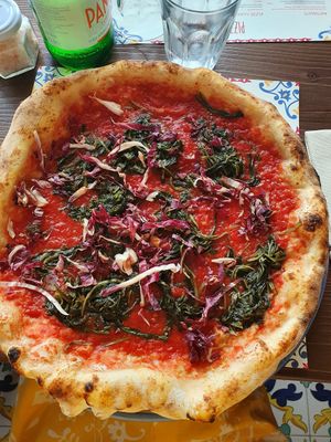 Red pizza with veggies at Pizzium - Trento  in Trento