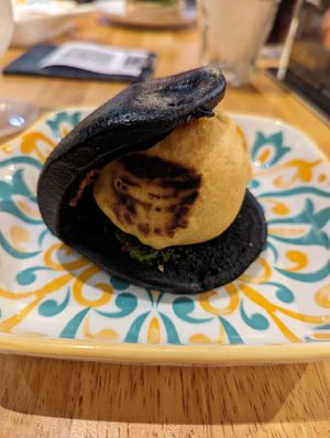 Batata vada in a charcoal bun  at Bombay Talkies in Kuala Lumpur