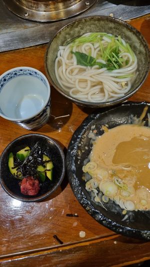 they serve you noodles last, on the right is the peanut sauce and on the left a cucumber side at Shishabu Shabu Aoyagi - 志ゃぶしゃぶ 青柳 in Nakatsugawa