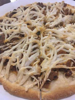 Double Joy pizza with soy and cashew cheese, vegan lamb and vegan beef  at Vegan Taipei in Taipei