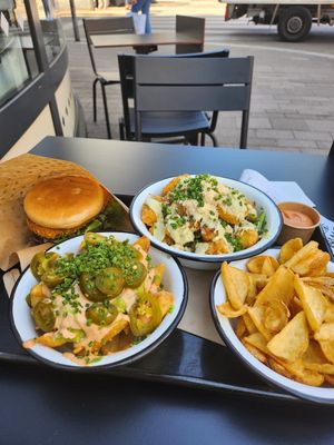 New chicken burger, loaded fries and cesar salad bowl at Swing Kitchen - Invalidenstraße  in Vienna