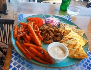 Gyros. With sweet potato fries on recuest. Verry tastes but the gyros was not enough. My friend wanted to eat 3 times that amount. at Tásos in Zakynthos