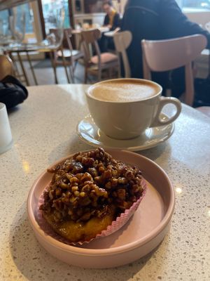 Latte with oat and vegan pecan sticky bun  at Petunia's Pies and Pastries in Portland