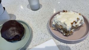 Boston Creme Doughnut and Regular Cinnamon Roll  at Petunia's Pies and Pastries in Portland