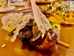 Grilled Miso Shiitake: Chinese Cabbage - Kumquat - Peanuts - Rice crisper - Coriander sauce at Heritage in Ghent