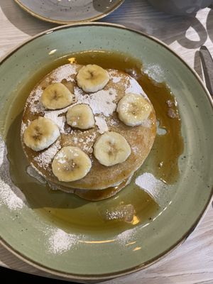 Vegan pancakes with banana and maple syrup  at The Veg Box Cafe - London in North West London