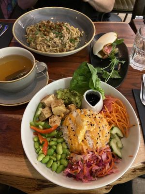 The spread (vegan carbonara, mint tea, bao, sushi salad bowl)  at The Veg Box Cafe - London in North West London