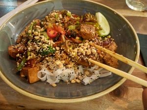 Teriyaki noodles with tofu, good portion (chopsticks close to camera). at The Veg Box Cafe - London in North West London
