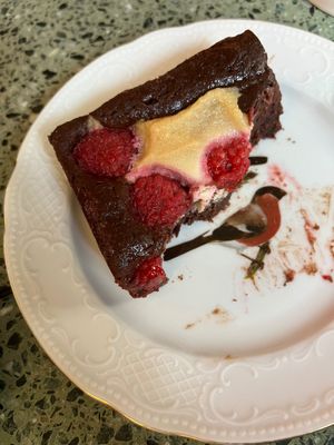 Raspberry brownie (on a cute plate). at Korzenie Kuchnia Roślinna  in Szczecin