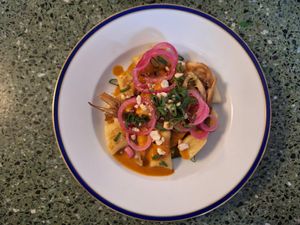 Kopytka with curry sauce at Korzenie Kuchnia Roślinna  in Szczecin