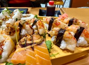 Sushi boat upclose showing Shrimp Nigiri and Sashimi Salmon at Vegan Sushi House  in Lisbon